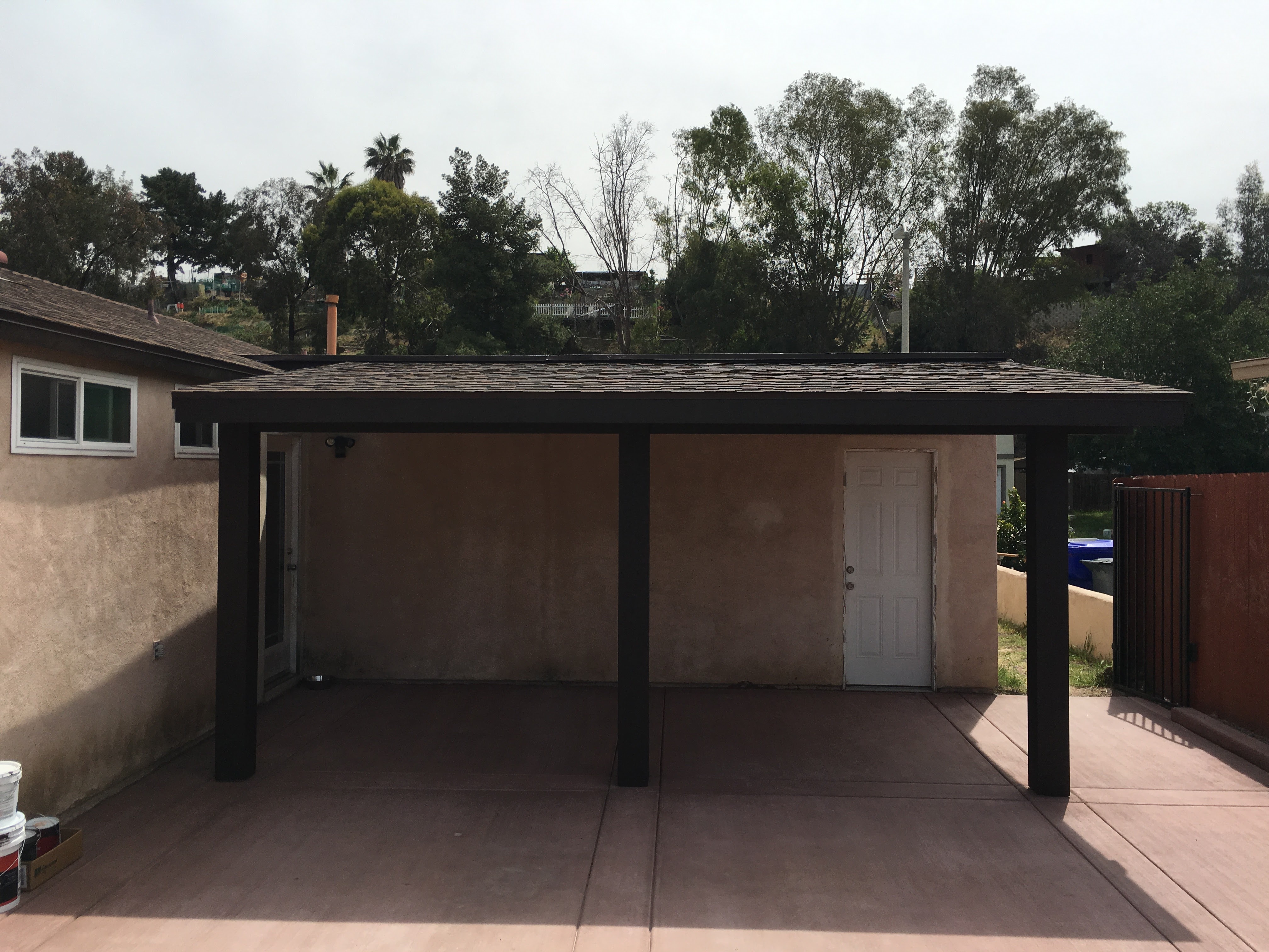 Modern backyard landscaping and concrete after completion