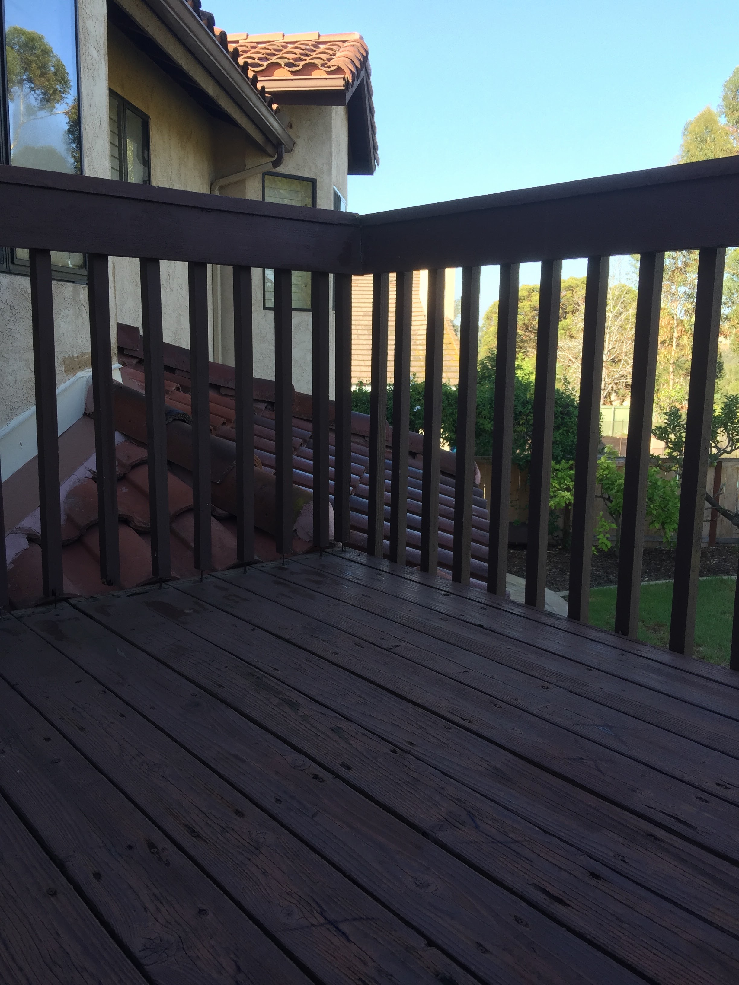 Weathered patio and deck before restoration